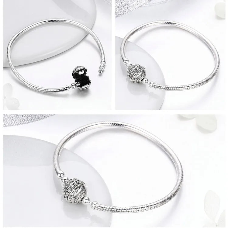 Silver bracelet with sparkling clear cubic zirconia stones, snake clasp and flower clasp